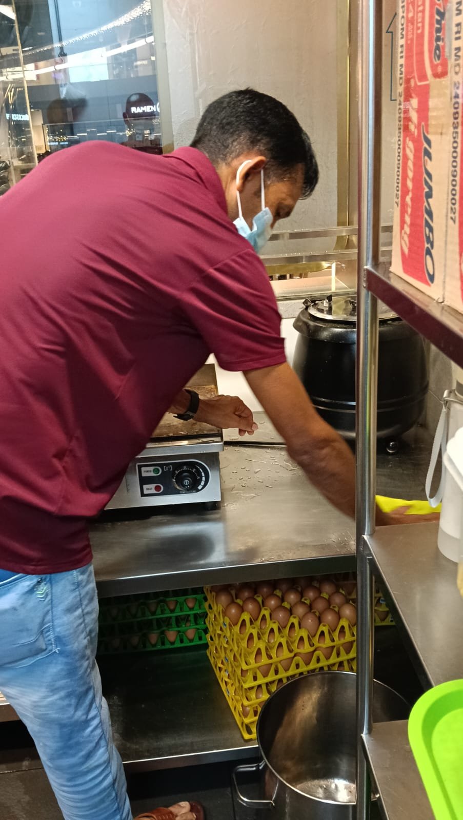 Sani Clean staff squeegeeing a stall floor